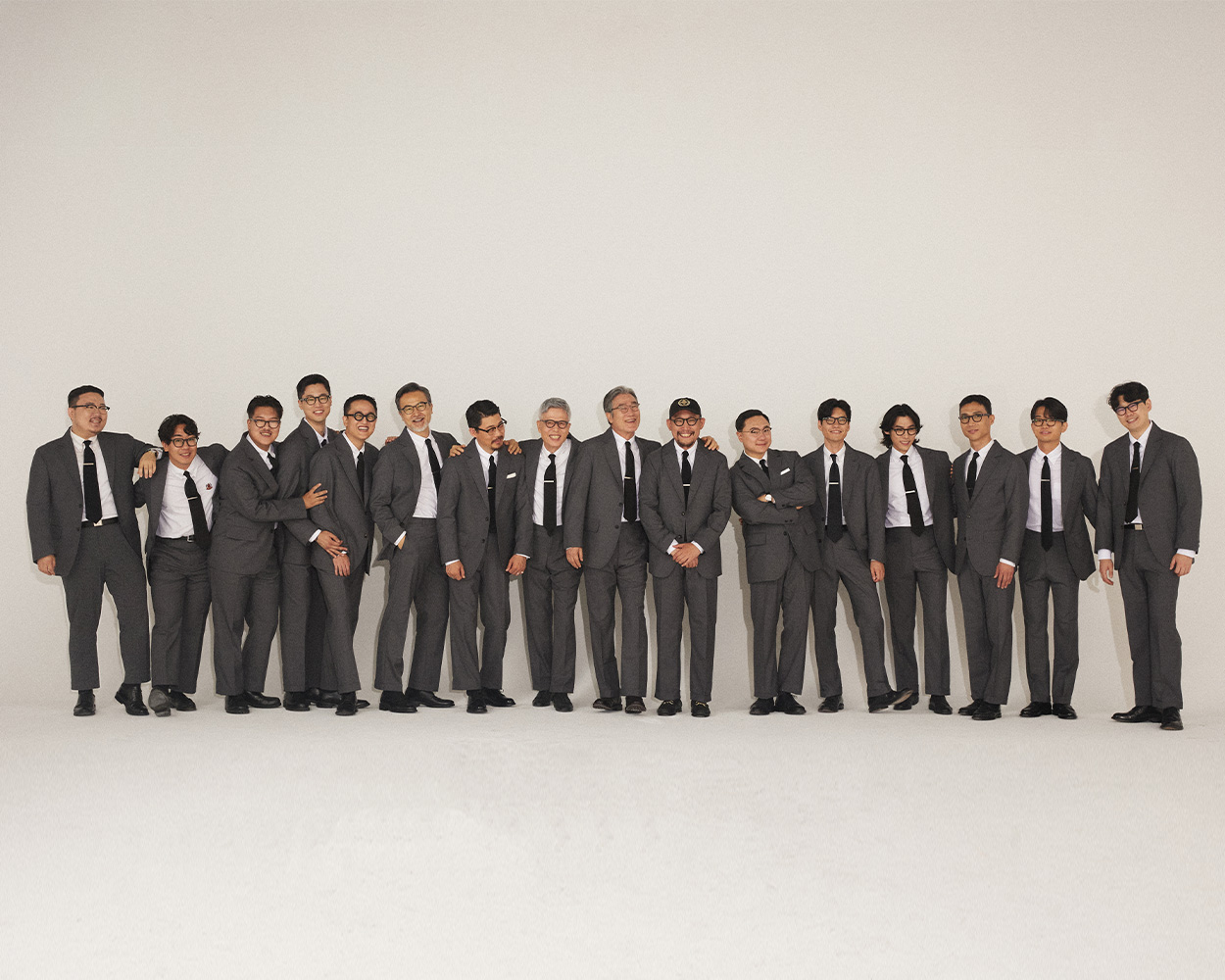 Classic grey sack suit representing the relaxed elegance of American Ivy Style