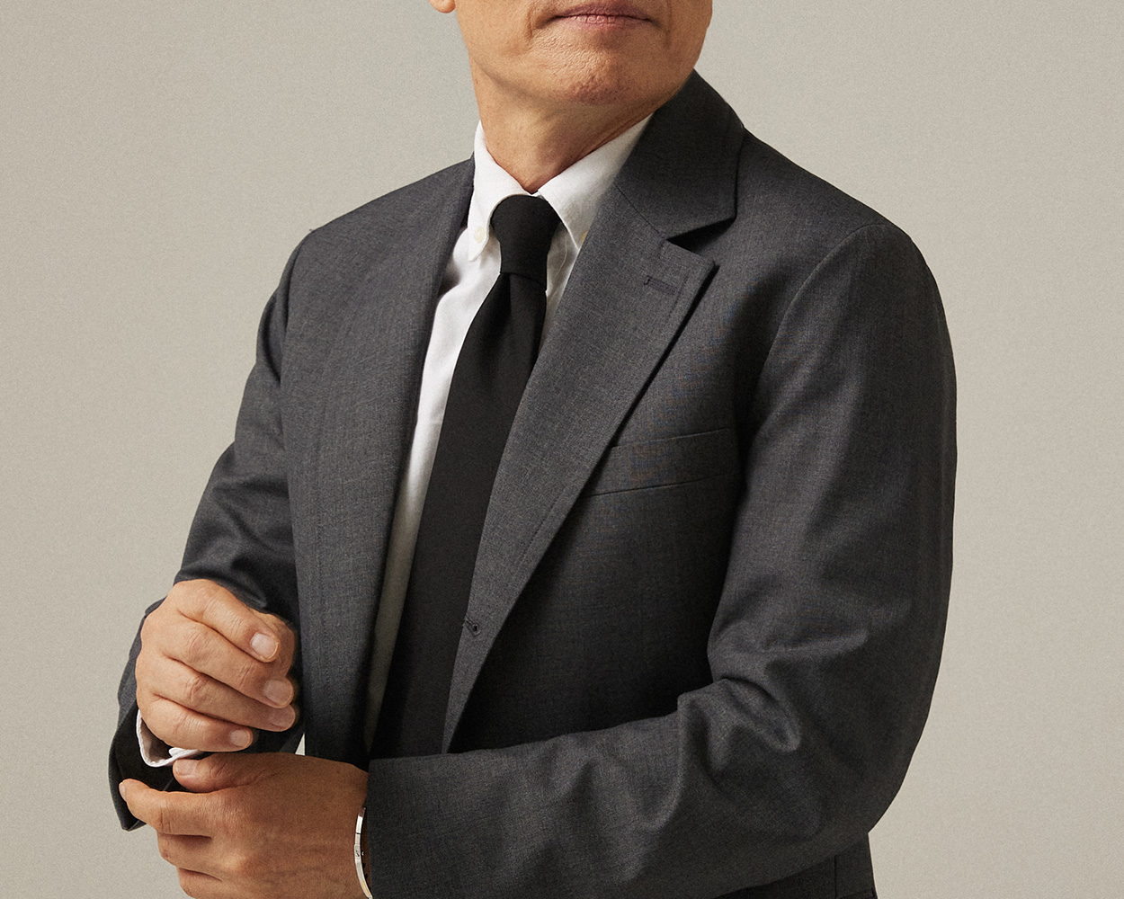 Renacts grey sack jacket featuring a restrained notched lapel