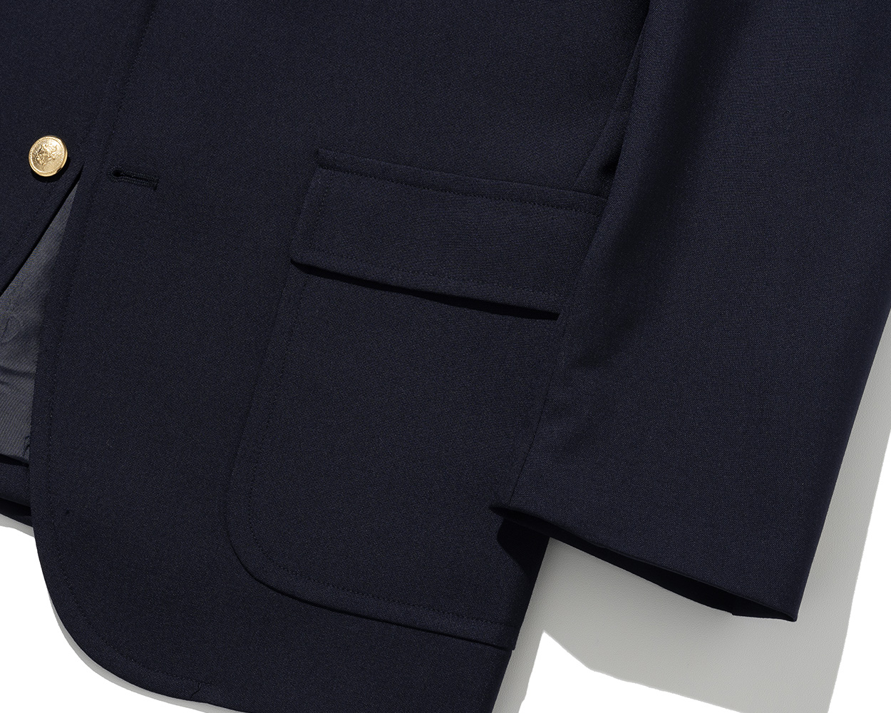 Flap patch pocket detail representing Ivy blazer craftsmanship