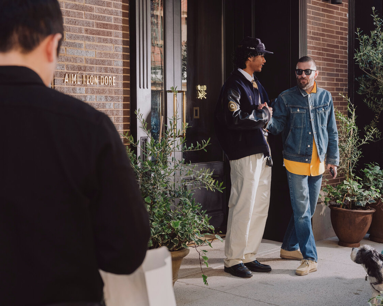 Aimé Leon Dore Ivy-inspired menswear with blazers, knitwear, and loafers in warm earthy tones