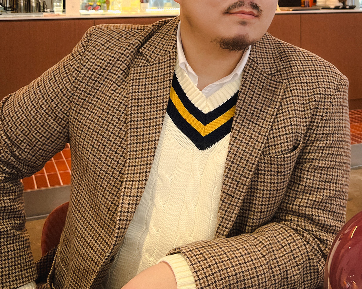 Gun Club jacket layered over a cricket sweater in Ivy style