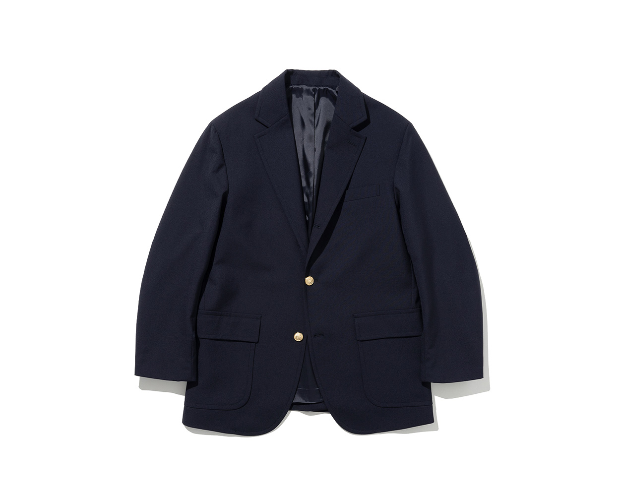 Navy blazer with brass buttons in classic Ivy style
