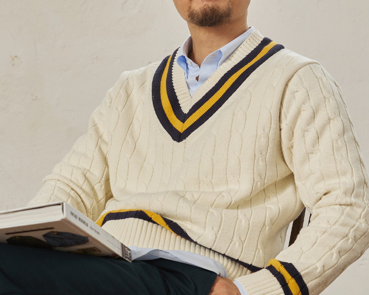 Renacts Cricket Knit featuring balanced V-neck and classic cable pattern