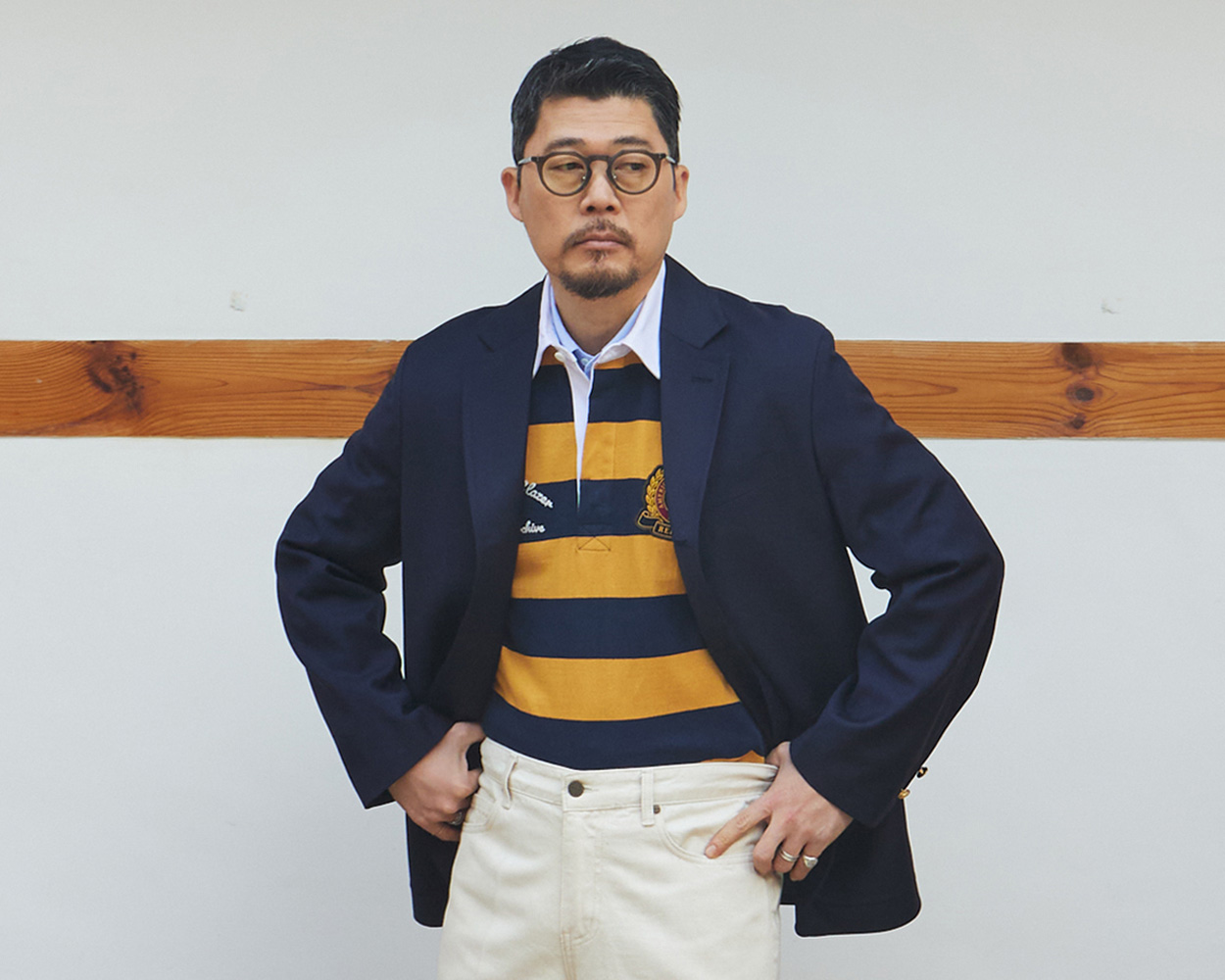 Renacts navy blazer styled as part of a complete Ivy Style wardrobe