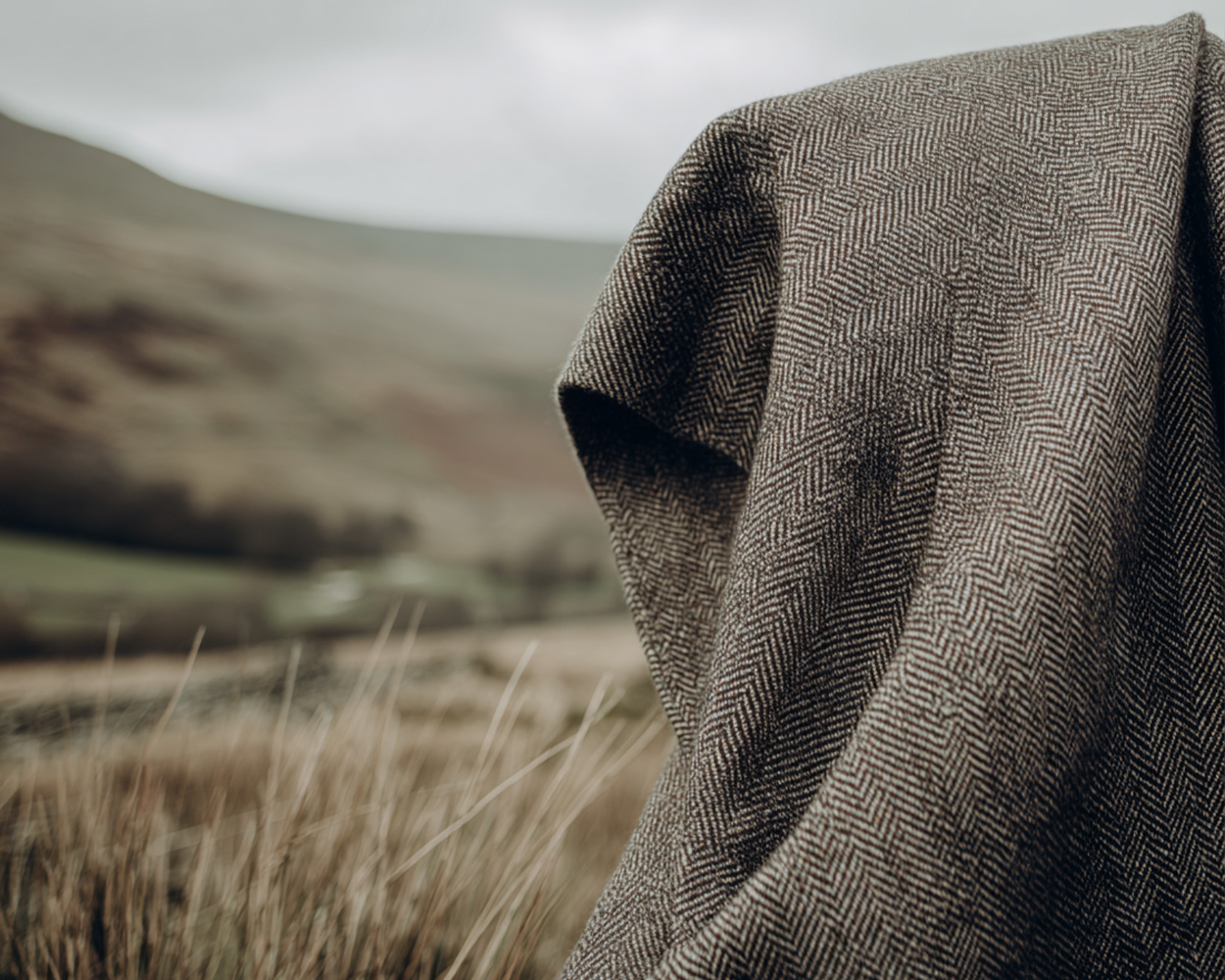 Traditional British herringbone tweed fabric rooted in countryside heritage