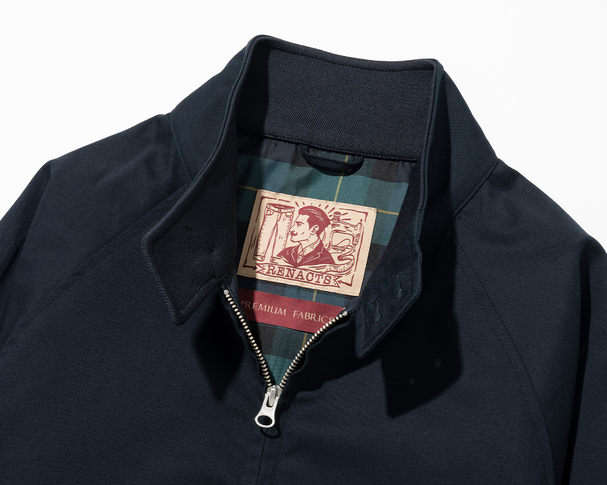 Key design details of a Harrington Jacket including ribbed hem and stand collar