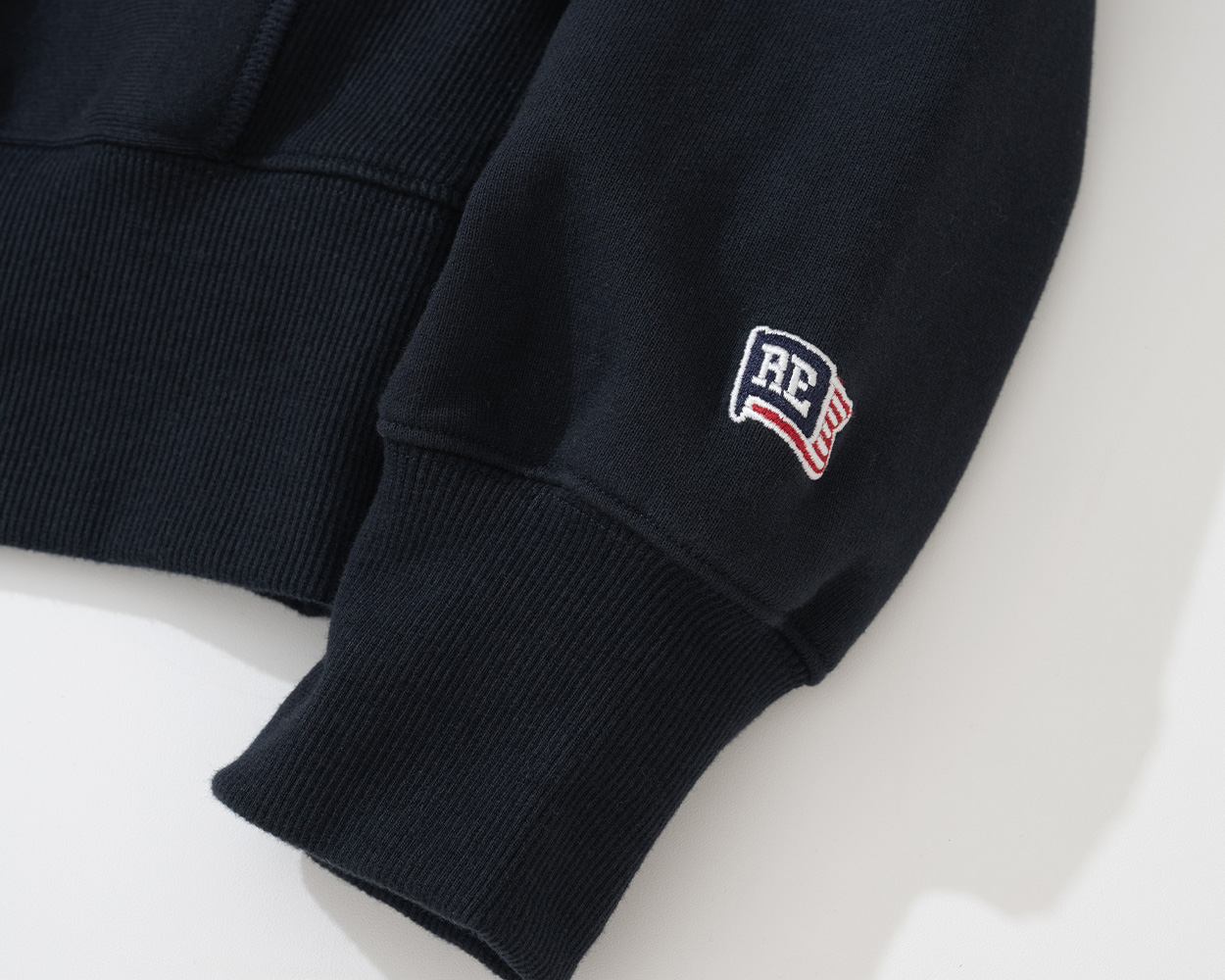 High-quality track stitching and sleeve label on Renacts reverse weave sweatshirt