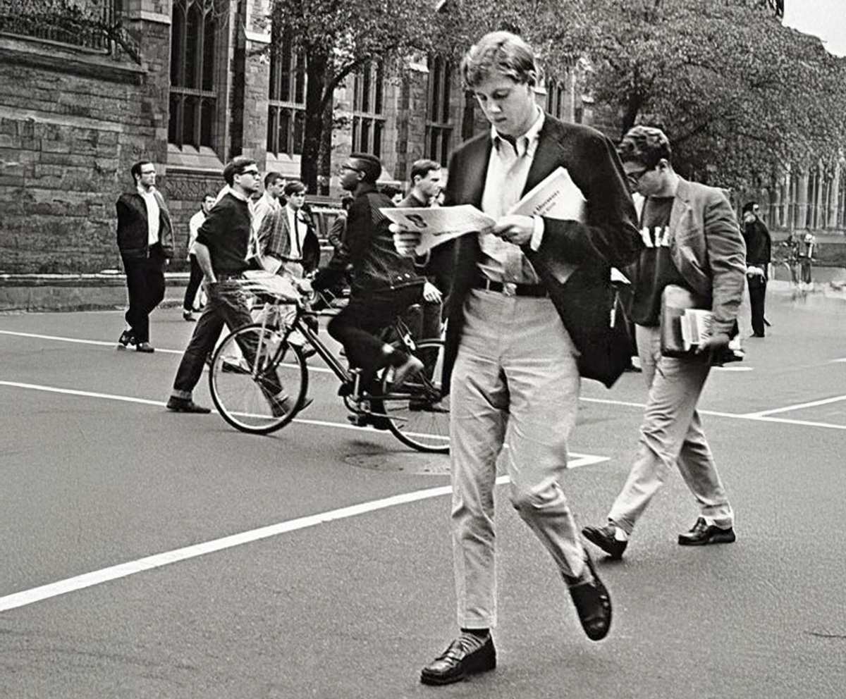 Classic black and white style photo of Ivy League students wearing sack jackets on campus.