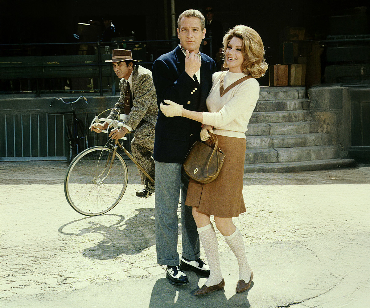 A man wearing a jacket in a vintage atmosphere, reminiscent of a scene from a classic film.