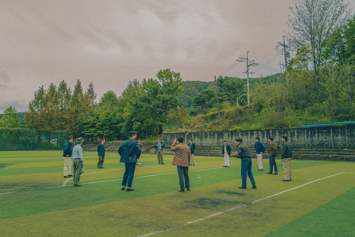 Ivy League students wearing oxford button down shirts on campus, circa 1960s