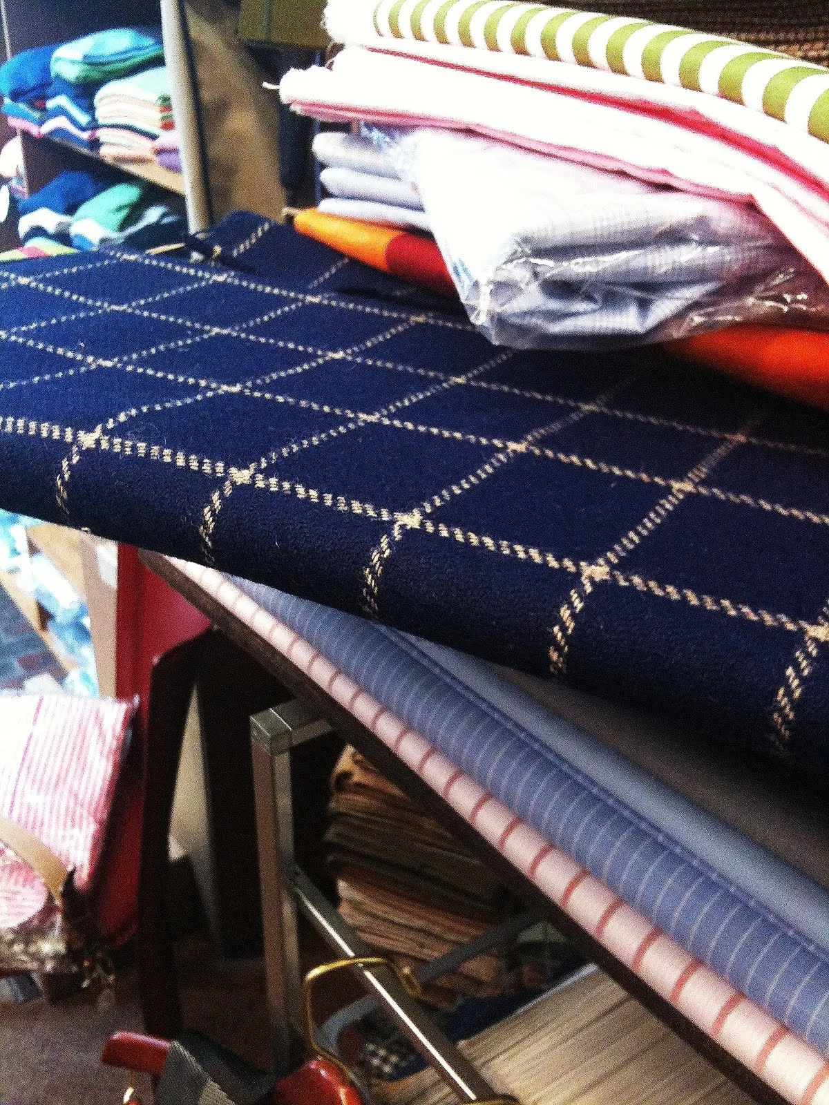 Andover Shop history: interior view of fabrics, ties, and accessories displayed in the Cambridge store