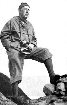 Anorak jacket history — 1920s-30s European mountaineer in a hooded climbing anorak holding a Leica camera