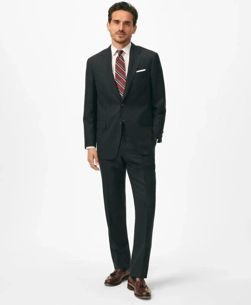 Brooks Brothers history: the American-Made No.1 Sack Suit in navy pinstripe wool — 3/2 roll lapel, natural shoulder, undarted front, straight trouser, introduced in 1901 and still produced today