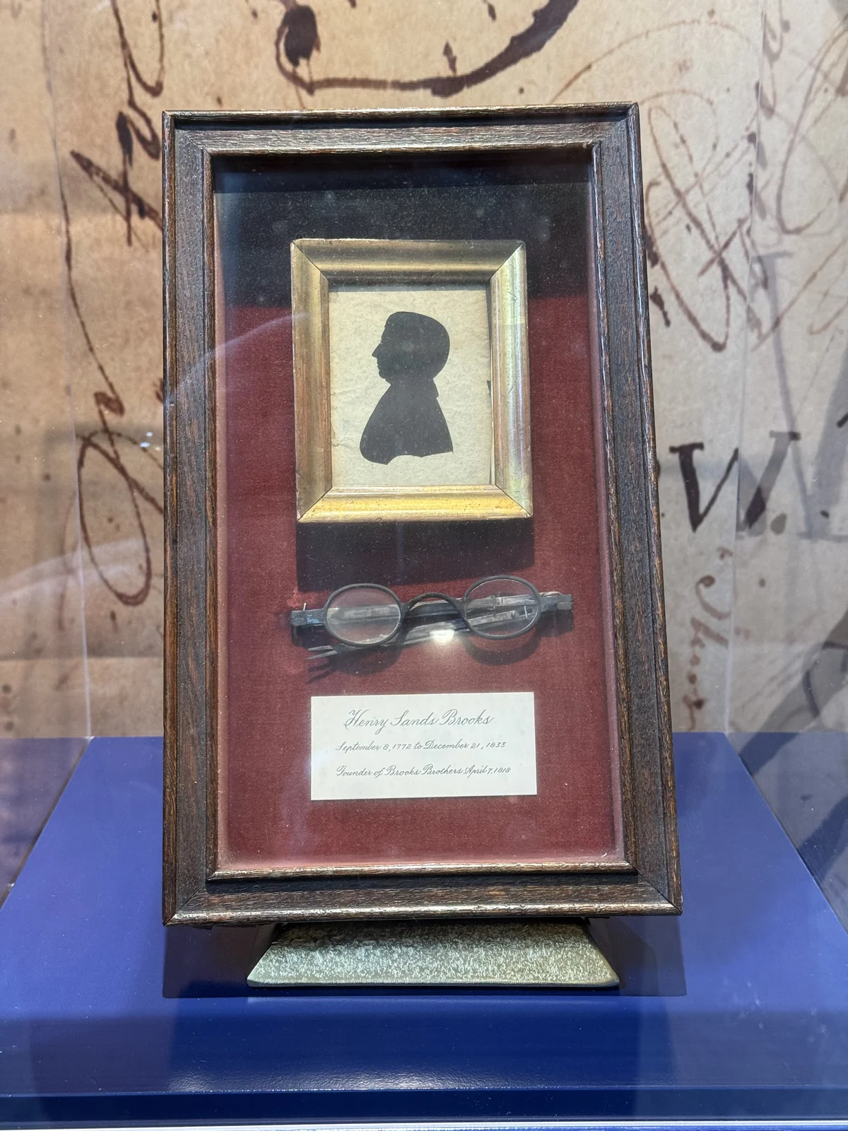 Brooks Brothers history: a silhouette portrait and original eyeglasses of founder Henry Sands Brooks (1772-1833), displayed at the flagship