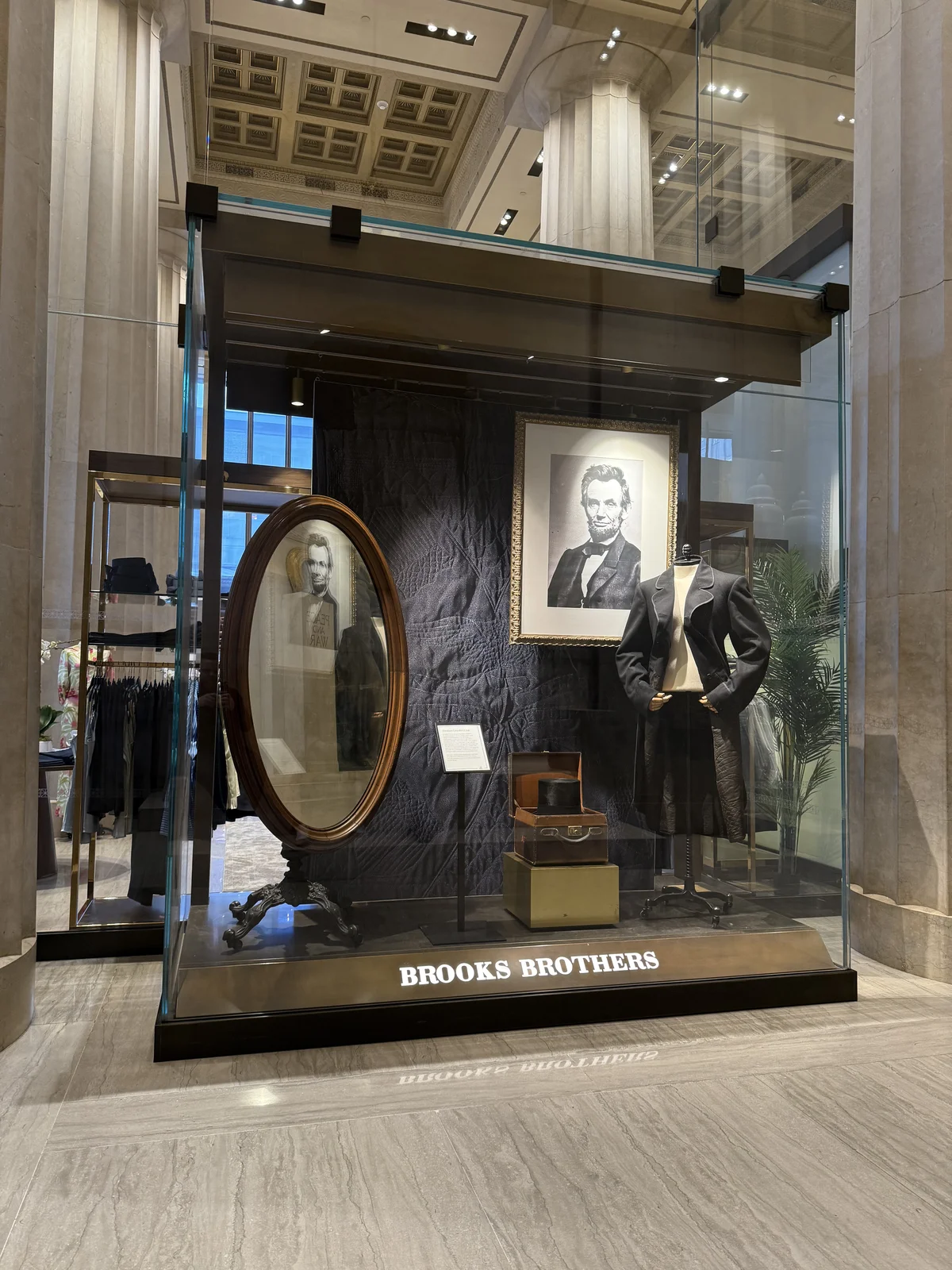Brooks Brothers history: Lincoln's second inaugural coat display case at the flagship, featuring the coat cut by Brooks Brothers with 'One Country, One Destiny' embroidered in the lining