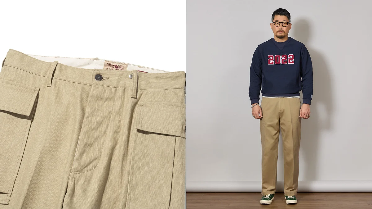 Khaki chino trousers showing the smooth cotton twill weave that defines the garment
