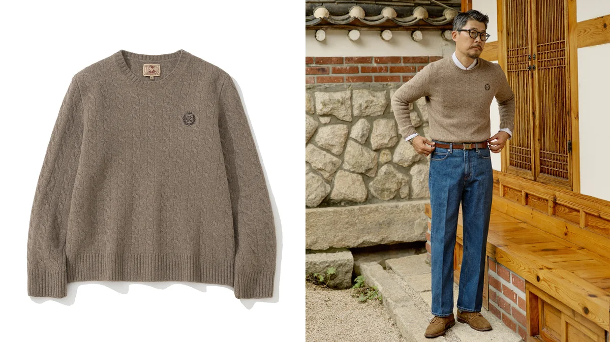 Crewneck sweater layered over an oxford shirt with penny loafers