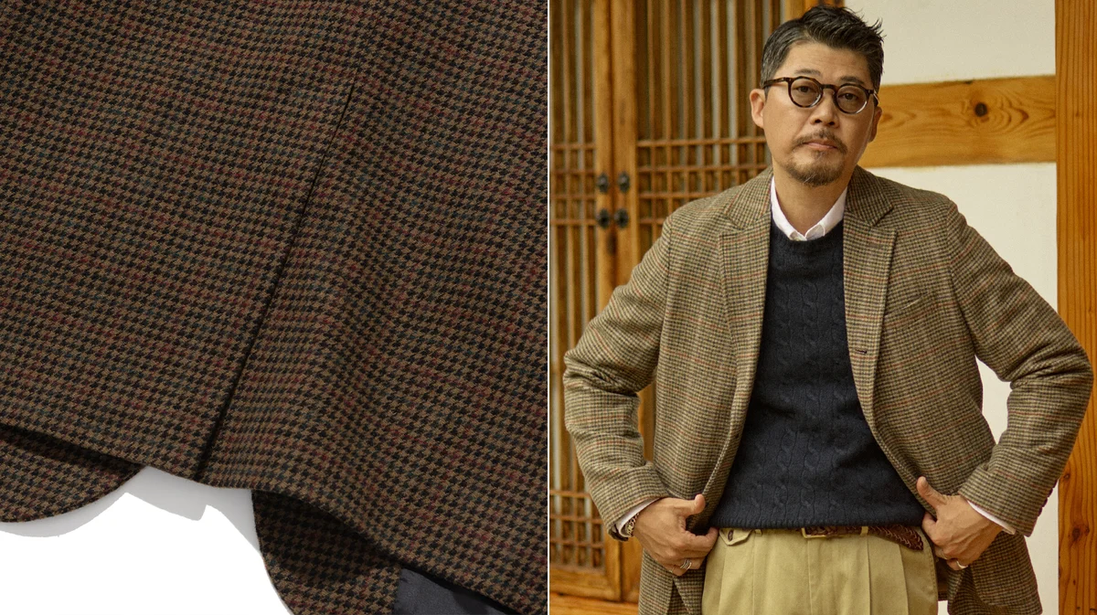 Navy blazer worn over a white oxford shirt and khaki chinos in classic Ivy League style