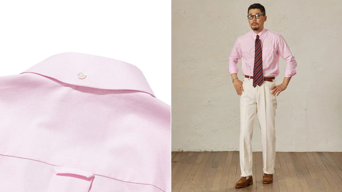 White oxford cloth button-down shirt showing soft collar roll, tucked into khaki chinos with a leather belt