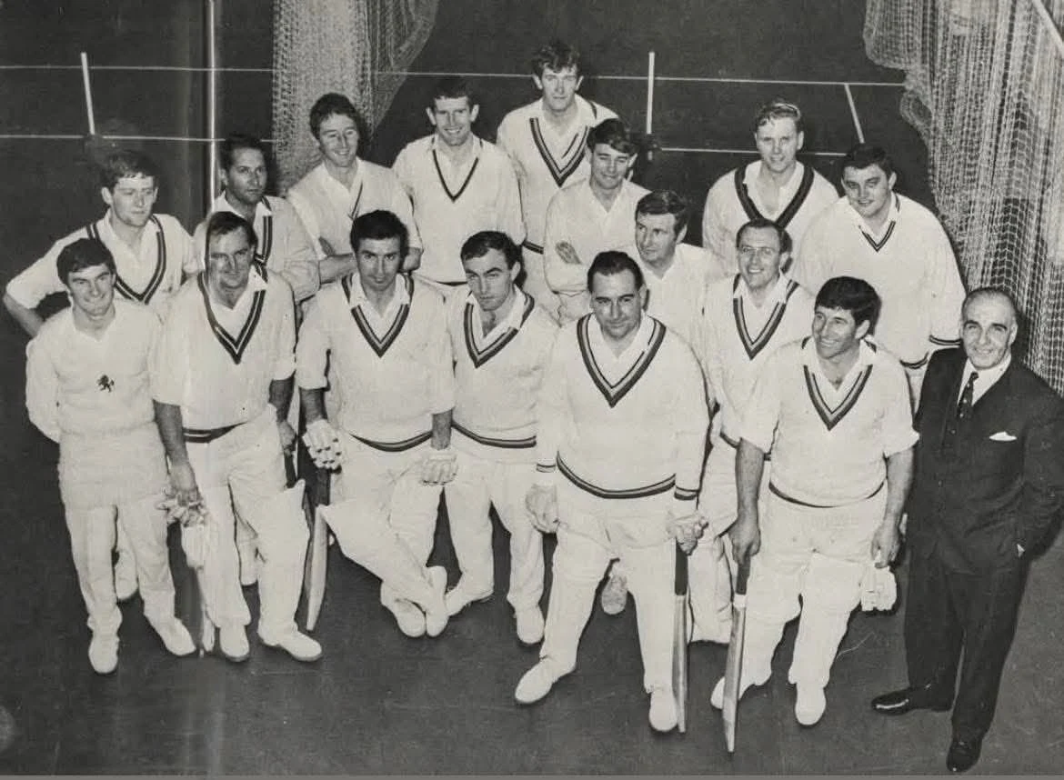 Cricket sweater heritage: a late 1960s cricket team in the classic cable-knit V-neck cricket sweater with three-stripe club-colour tipping — the design Paines of Godalming standardised in the 1920s