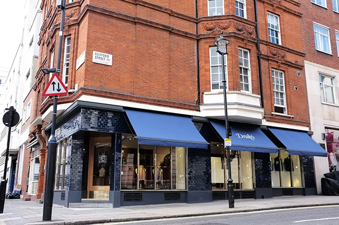 Drake's of London history: interior of Drake's Haberdasher Street factory in London — the 2013 consolidated headquarters housing the tie factory, design studio, showroom, and warehouse