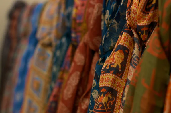 Drake's of London history: stacks of Drake's wool and cashmere scarves, the original 1977 product category before the brand expanded into ties and shirts