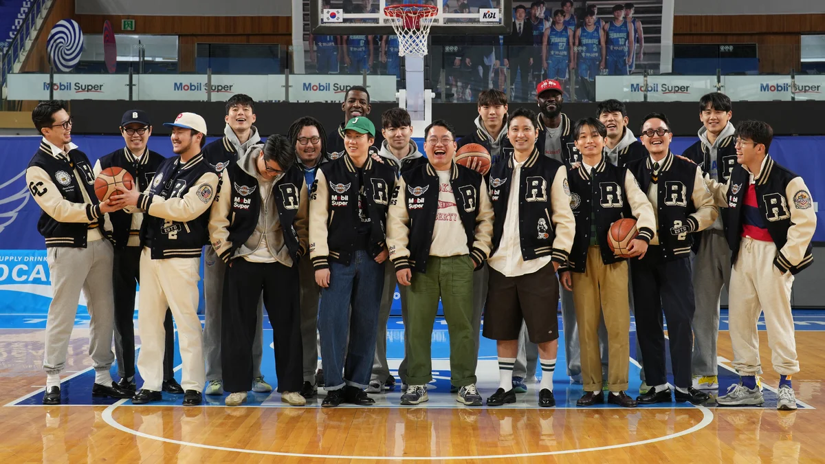 Penny loafers styled with layered Ivy pieces on the streets of Seoul — the Heavy Ivy approach in action