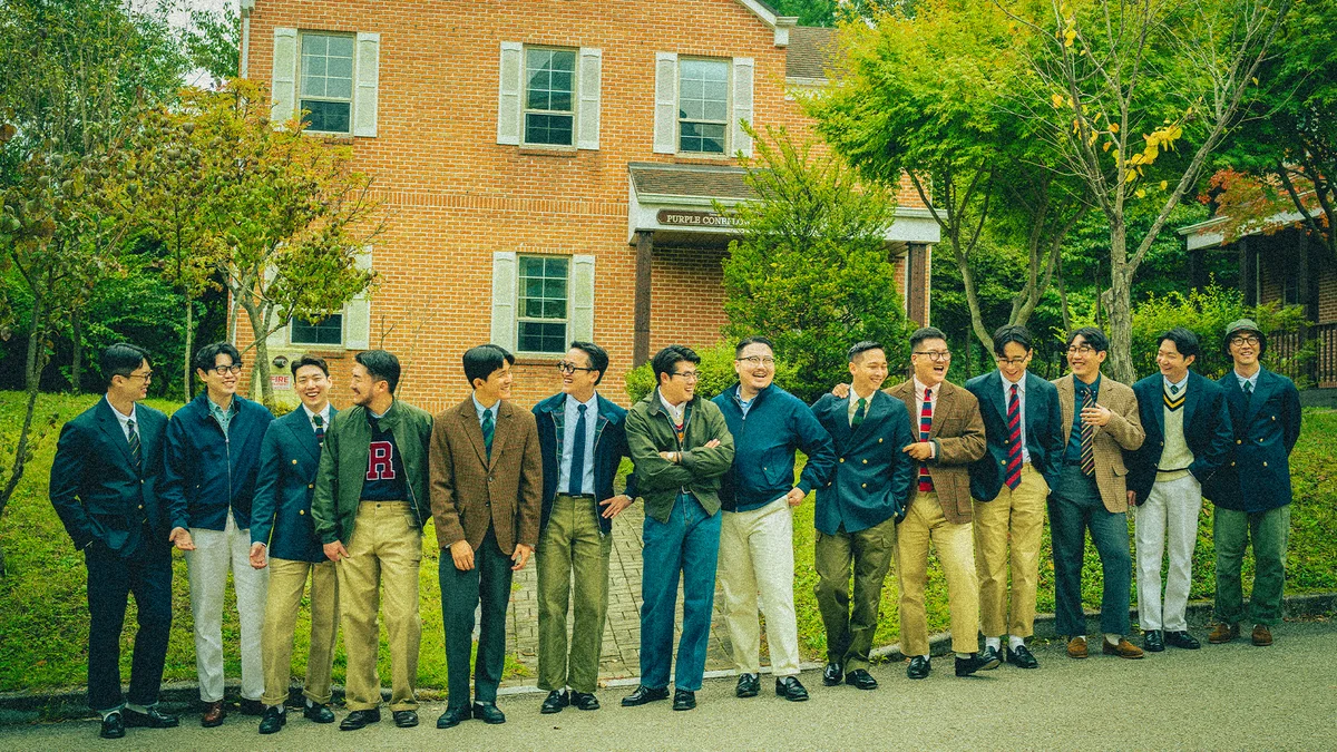 Modern Seoul take on the Ivy tie look — repp stripe tie layered under a crewneck sweater with an oxford shirt