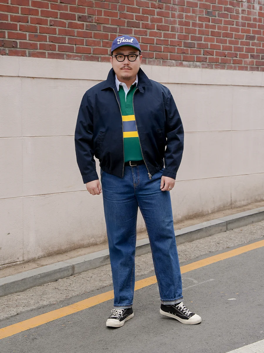 Harrington jacket casual outfit — navy harrington jacket with popped collar detail