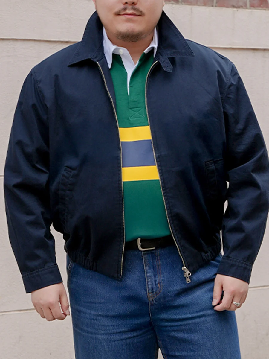 Harrington jacket casual outfit — navy lettered ballcap and black horn-rim glasses accessories