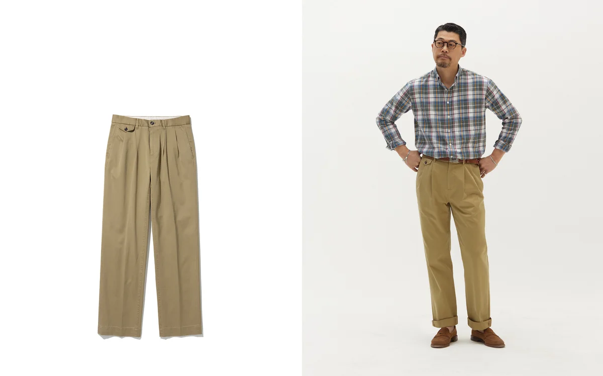 Vintage photograph of a young man in khaki chinos and a blazer with a striped tie, late 1950s