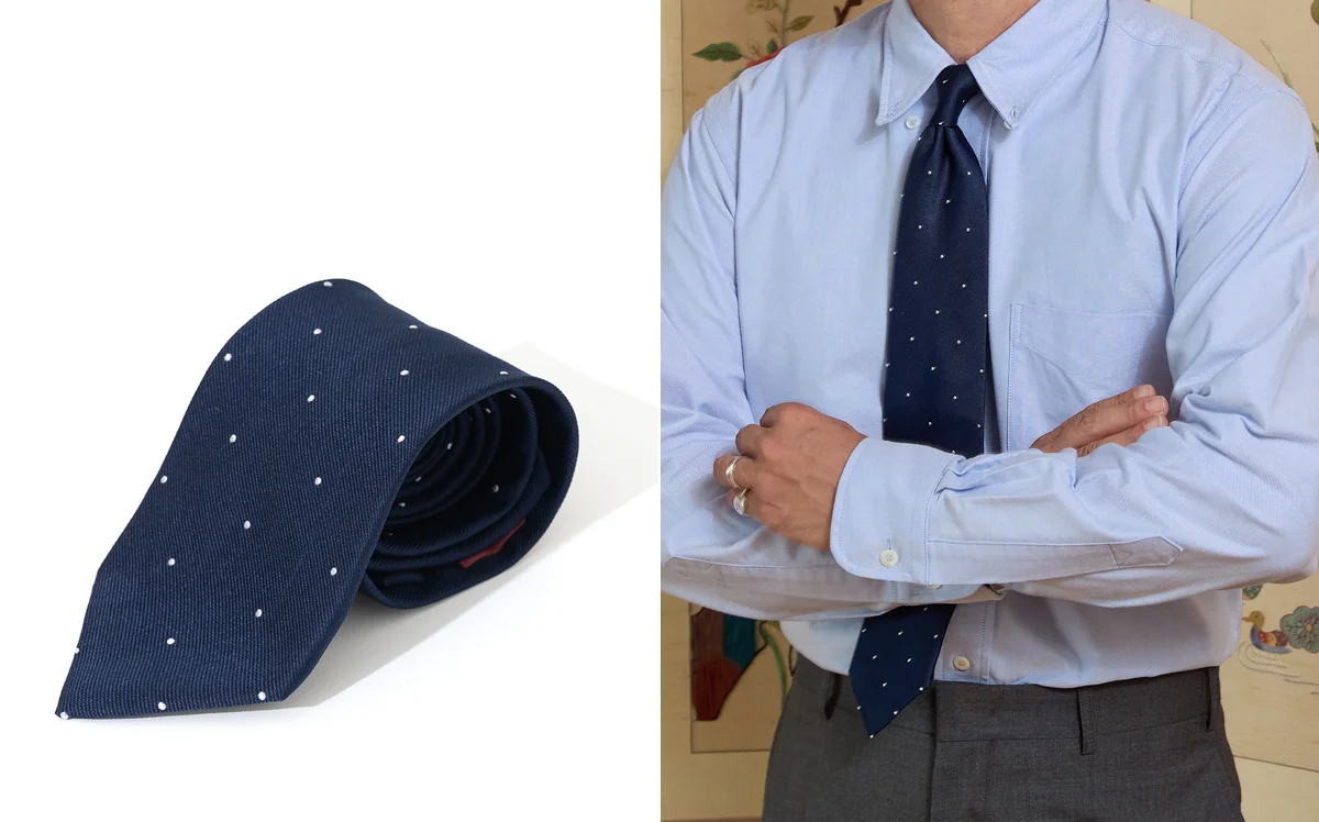 A striped tie styled with a crewneck sweater and oxford shirt in Seoul Traditional layered approach