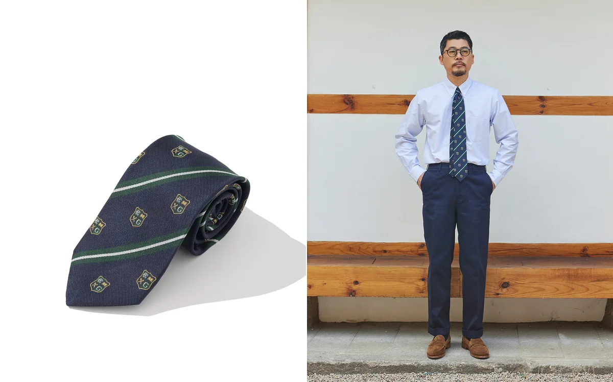 Close-up of a repp tie showing the four-in-hand knot with a slight dimple below the knot