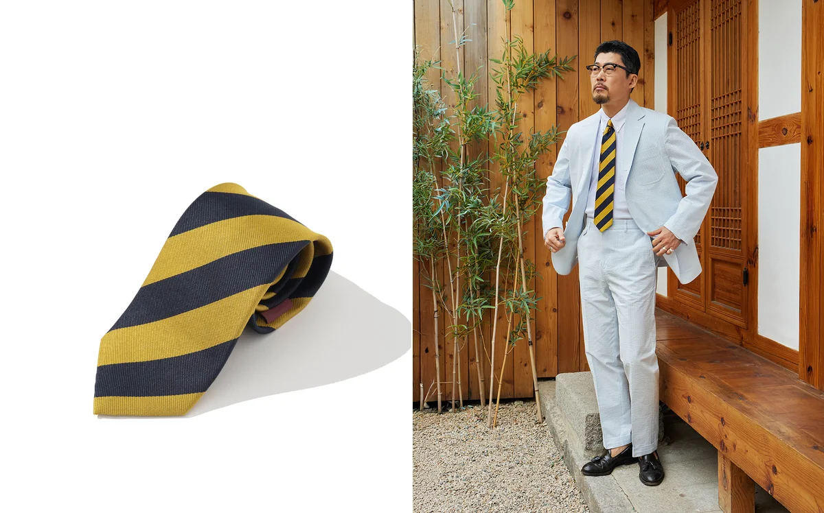 Students on an Ivy League campus in the 1960s wearing repp stripe ties with button-down shirts and blazers