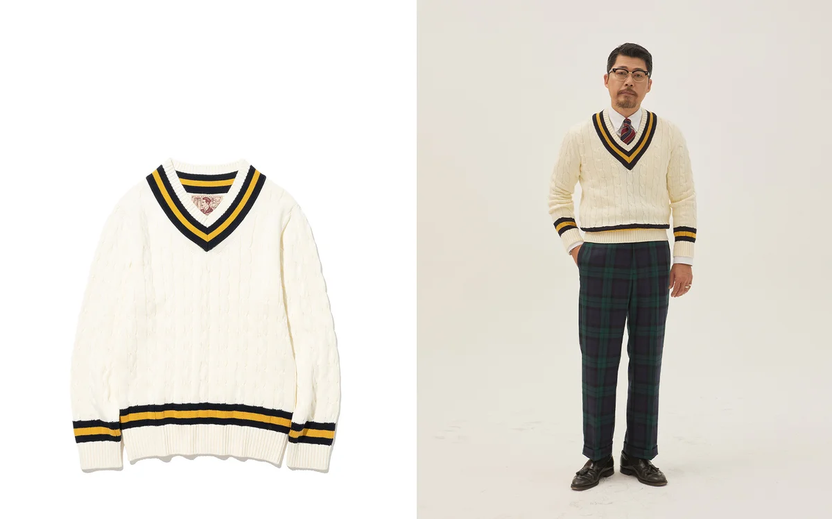 Navy crewneck sweater layered over OCBD under sport coat — the classic three-layer Ivy stack