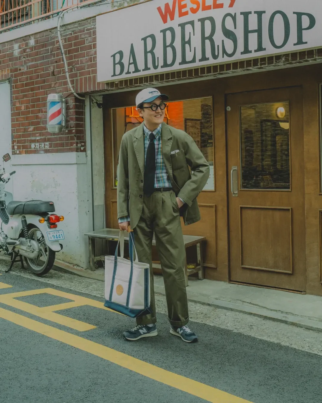 How to wear madras shirt with tie — olive blazer-and-trouser set with madras and tie, barbershop street