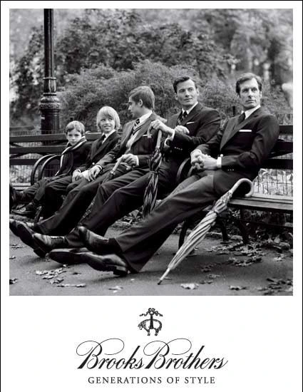 Brooks Brothers Generations of Style — vintage editorial of five males of different generations (small boy through senior gentleman) on a park bench, all in natural-shoulder sack-cut suits, demonstrating cross-generational continuity