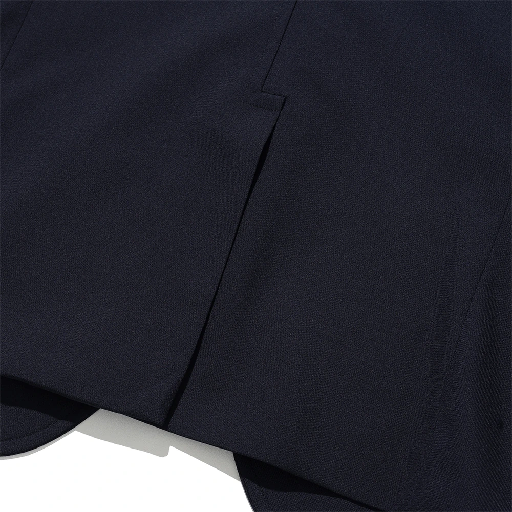 Renacts navy gold-button blazer hook vent — single rear vent ending in a small angled hook at the top, the canonical American Ivy detail