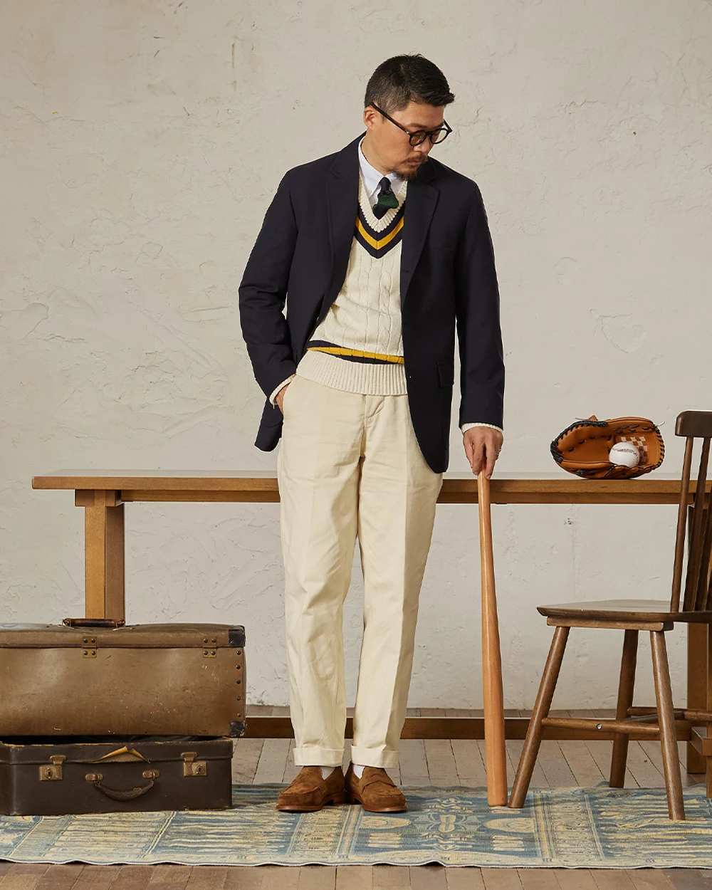 Navy gold-button blazer outfit with cricket sweater — blazer over cricket, white OCBD, regimental rep tie, ivory chino, plaque belt, brown suede penny loafers, ivory and suede preppy variant