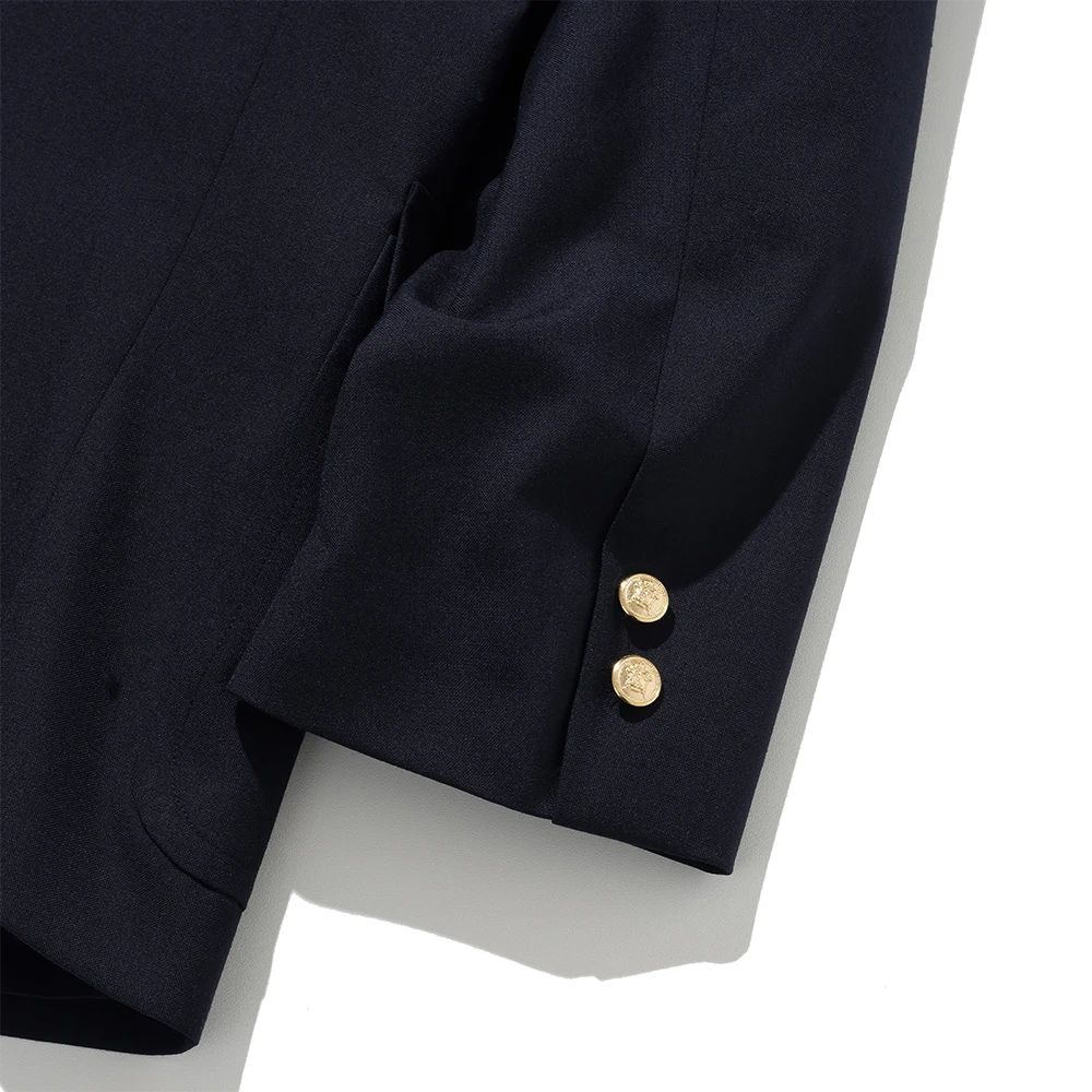 Renacts navy gold-button blazer sleeve cuff detail — two functional gold buttons on sleeve, real buttonholes