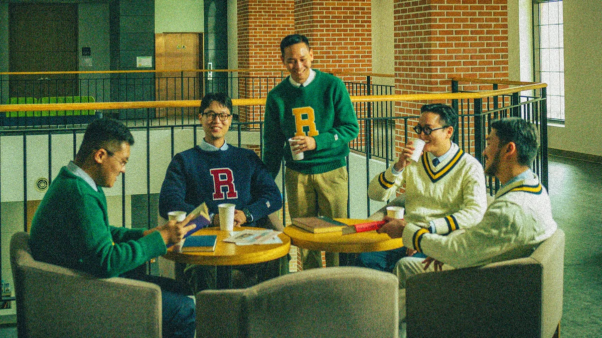 OCBD layered under a crewneck sweater showing the classic Ivy League collar roll