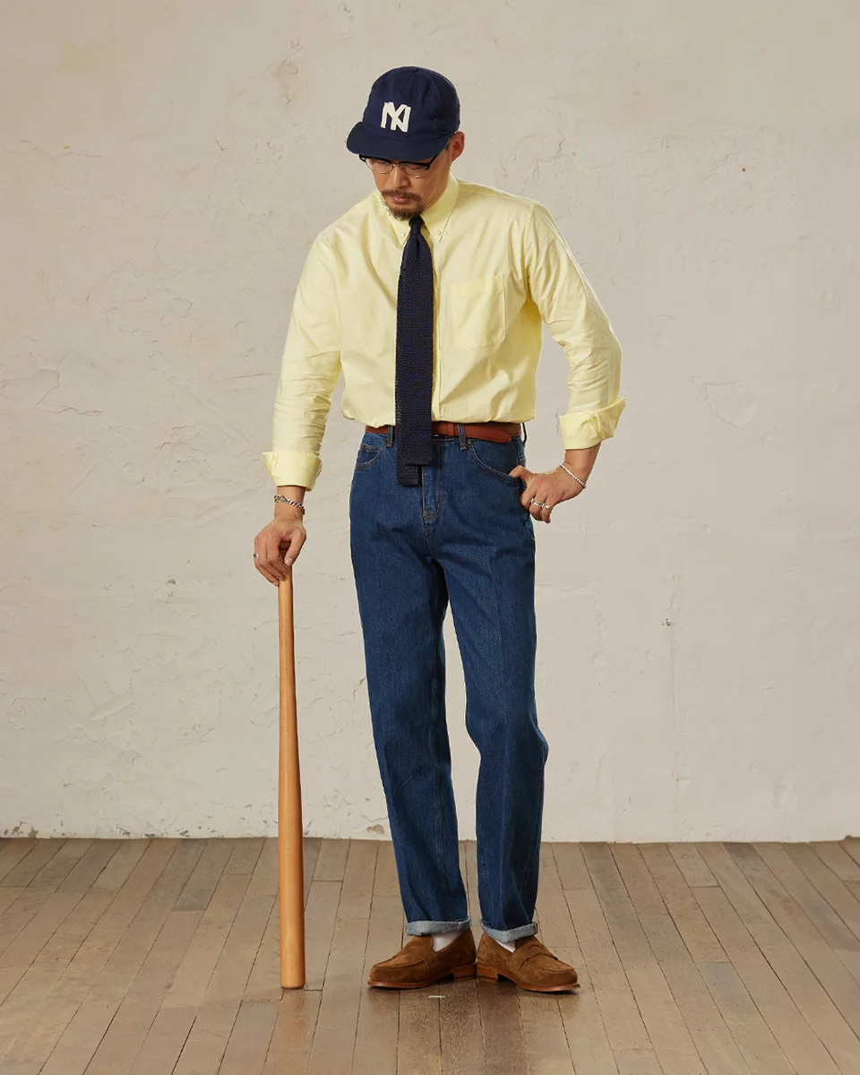 Knit tie paired with an OCBD shirt and rolled sleeves for a dressed-down smart look