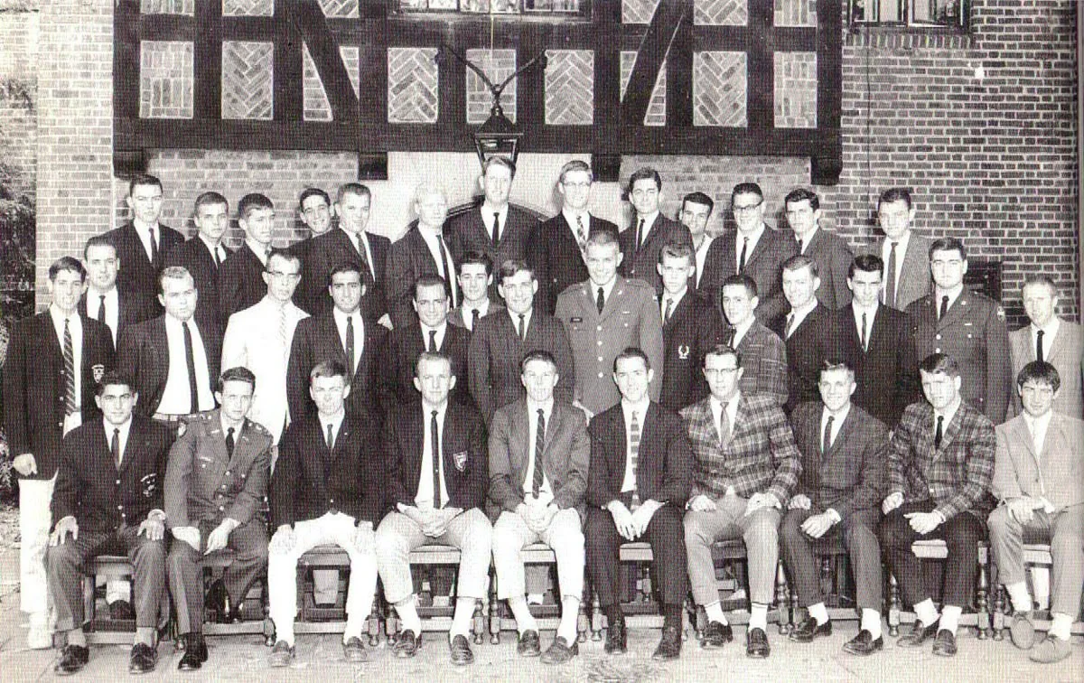 Yale Ivy style — a mid-century Yale residential-college or society portrait showing the 40-plus young men uniformly in the sack jacket, tie, and chinos vocabulary the 1965 Dress Study Group codified