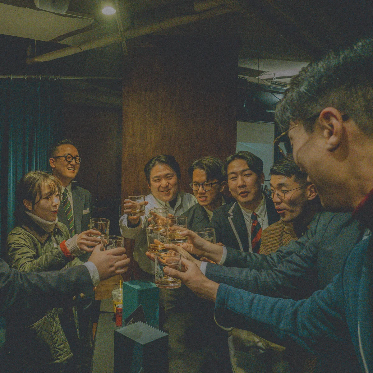 First toast of 2024 — members of Gentlemen's Club raising glasses in a circle