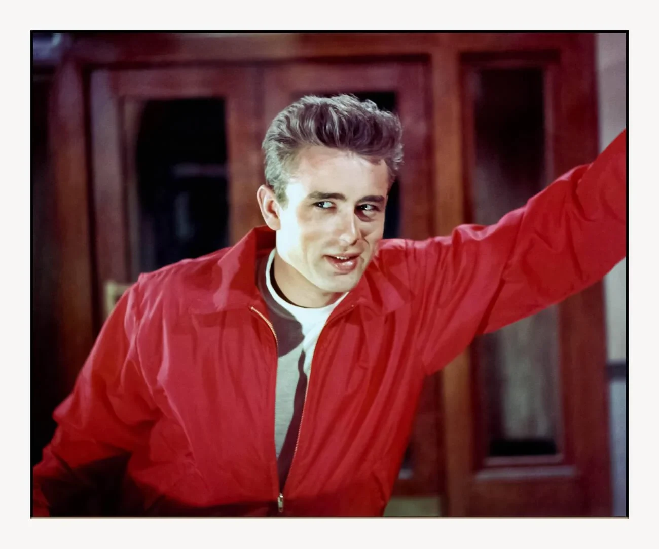 Levi 501 history 1955 cultural moment: James Dean Warner Bros publicity photo for Rebel Without a Cause, denim and red windbreaker becoming youth-uniform iconography