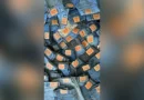 Levi 501 history thumbnail: pile of Levi's 501 jeans with red leather patches catching light, centered with blurred background — visualizing the 152-year history of the world's most reproduced denim