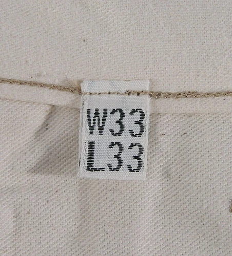 Cinch back chino history bridge to civilian — Quartermaster spec label W33 L33 from 1937–1942 Army khaki trouser