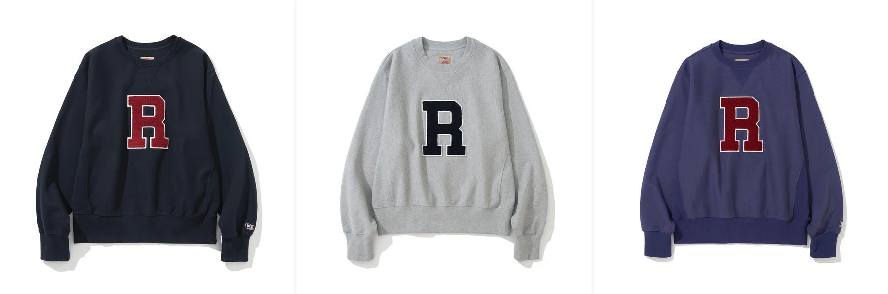 Renacts Letterman Ivy Sweatshirt three colorways — Navy, Grey, and Purple with chenille R house mark applique