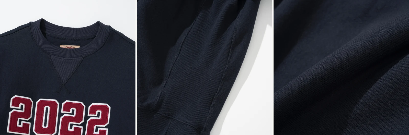 Reverse weave history construction detail — Renacts collegiate sweatshirt V-stitch neck, side gusset, and cross-grain hem in close-up