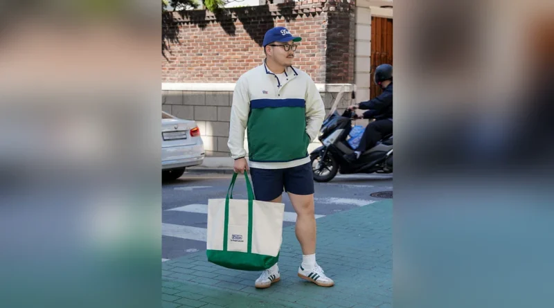 Anorak shorts outfit thumbnail — Renacts bicolor anorak, navy shorts, Polo Ralph Lauren canvas tote, Adidas Samba on a Seoul side street